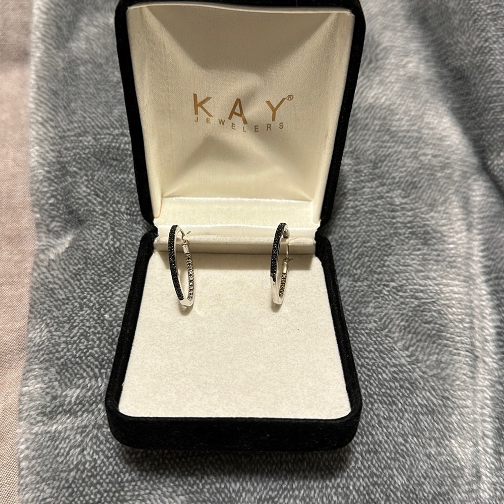 Kay jewelers small hoops. Half of the hoop is black stones.